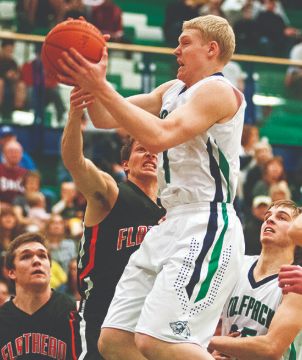 Bryan Michaels battles for a rebound during a game in 2014. Flathead Beacon File Photo