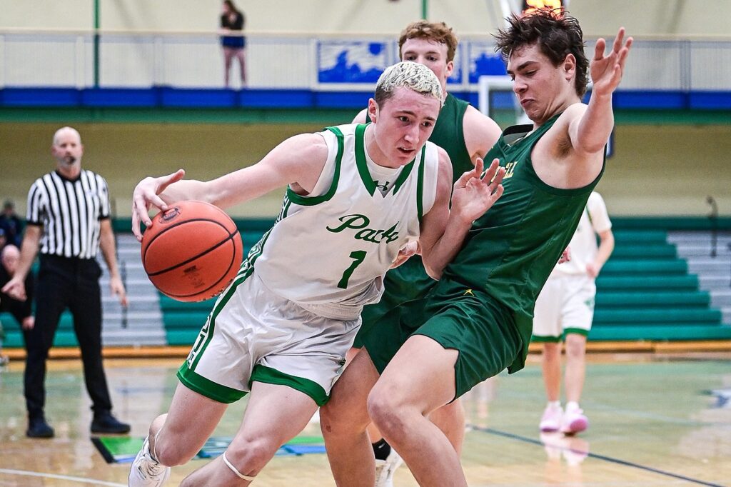 Glacier's Cooper Pelc (1) tries to dribble around Great Falls CMR's Drew Etcheberry (5) in the third quarter at Glacier High School on Friday, Dec. 13. (Casey Kreider/Daily Inter Lake)